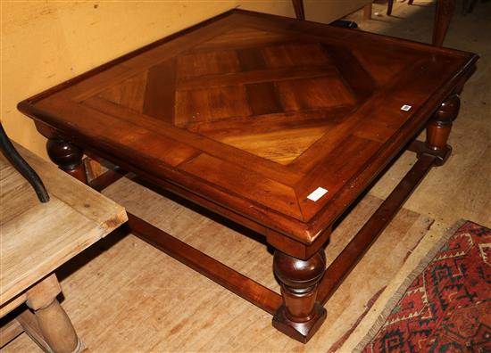 A modern square topped coffee table(-)